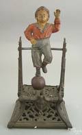 Boy on trapeze cast iron mechanical bank ca 1888