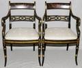 CANE AND BLACK LACQUER ARM CHAIRS SET OF FOUR