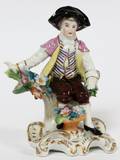 CHELSEA ENGLISH PORCELAIN FIGURE OF A BOY 19TH C