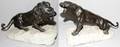052302 BRONZE LION SCULPTURES ON ROCKS 2