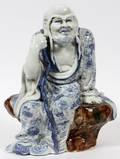 PORCELAIN ORIENTAL FIGURE OF A PRIESTLOHAN