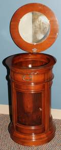 042498 ROUND HINGED TOP END TABLECABINET MAHOGANY