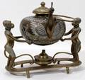 080255 INDIAN BRASS TEA KETTLE ON FIGURAL STAND H 12