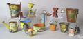 Eleven painted tin sand pails and watering cans earlymid 20th c tallest  6 34 h