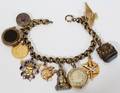 102306 GOLD FILLED CHARM BRACELET SOME CHARMS 14 KT