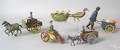 Five painted tin cart toys early 20th c