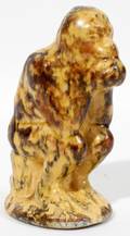 081365 MOTTLED YELLOW WARE POTTERY SEATED MONKEY BANK
