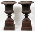 101416 NEOCLASSICAL STYLE LEAD URNS ON STANDS PAIR