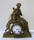 Seth Thomas gilt metal figural clock retailed by Mitchell Vance  Co