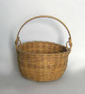 Woven basket with swing handle