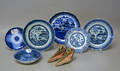 Group of blue and white Canton plates and saucers and a pair of Chinese shoes