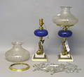 Pair of Pairpoint cobalt etched glass fluid lamps with etched shades