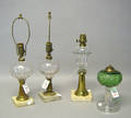 Three pressed clear glass fluid lamps