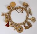 121299 14KT YELLOW GOLD BRACELET HUNG WITH CHARMS