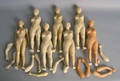 Seven plaster doll figures