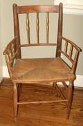 011589 ANTIQUE PEAR WOOD ARMCHAIR ROPE SEAT