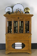 Coin operated band organ with oak case