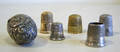 Three silver thimbles