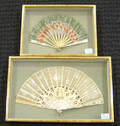 Two painted Victorian fans in shadow box frames