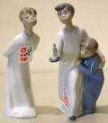 Two Lladro figures of a young boy with his sister