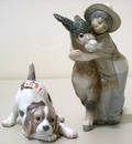 Two Lladro figures of a boy with a donkey