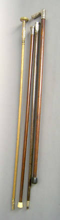 Three silver tip canes