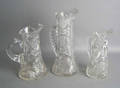 Three cut glass pitchers