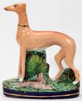 052381 STAFFORDSHIRE PORCELAIN WHIPPET WITH RABBIT