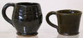 Two redware mugs by Thomas Stahl