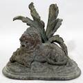 062568 METAL LION UNDER PALM FRONDS L 6
