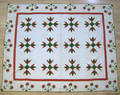 Pennsylvania applique quilt in a red and green tulip pattern
