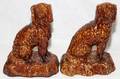 091440 ROCKINGHAM POTTERY SEATED DOGS 19TH C TWO