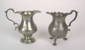 Two pewter cream pots