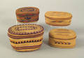 Four Northwest Coast twined lidded oval baskets