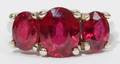 032188 56CTTW RUBY 14KT 3 STONE RING