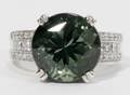 022163 750 CT GREEN TOURMALINE AND SIDE DIAMOND RING
