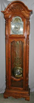 030387 HOWARD MILLER OAK GRANDFATHER CLOCK H 85 W 26