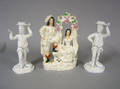 Pair of porcelain figural candlesticks