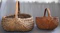 011564 HAND WOVEN OVAL BASKETS TWO H 12 H 15
