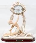 011595 ART DECO STYLE FIGURAL CLOCK H 14 W 12