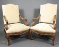 Pair of French Regence Style Walnut Fauteuils