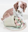 111423 LLADRO PUPPY WITH FLOWERS IT WASNT ME