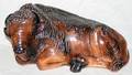 092466 POTTERY RECLINING BUFFALO L 16 H 9