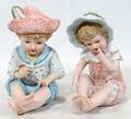 062511 HAND PAINTED BISQUE BOY  GIRL PIANO BABIES