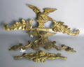 Two carved giltwood eagle pediments