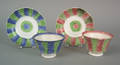 Two rainbow bullseye spatter cups and saucers 19th c