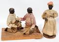120492 AFRICAN AMERICAN CARVED MUD FIGURES TWO
