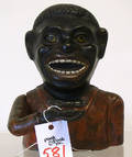 Cast iron jolly black man mechanical bank