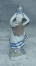 120540 PORCELAIN FIGURE OF A WOMAN CARRYING FISH