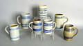 Seven stoneware mugs